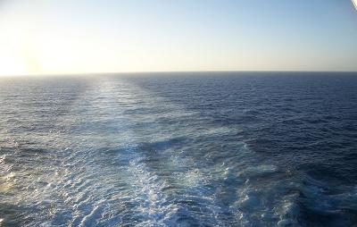 The churning sea behind us