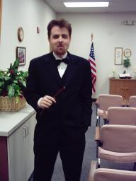 Queerby, in a tux, with Slim Jim.